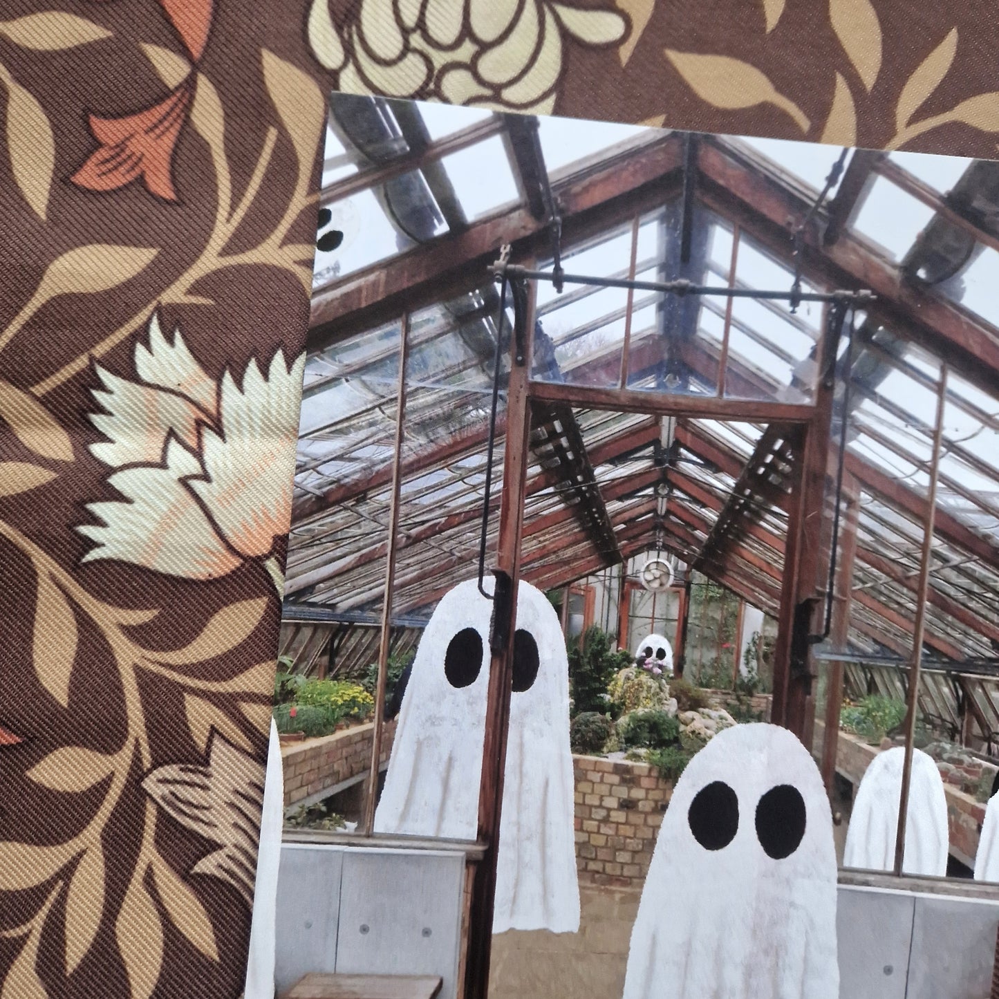 A closer view of the print showing the greenhouse and the group of ghosts in more detail.