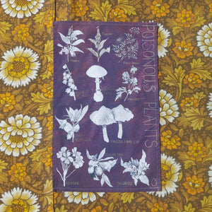 A warm purple tea towel sits on a white, yellow and brown floral patterned background. The tea towel features the words ‘POISONOUS PLANTS’ in pastel yellow writing down the right side. The rest of the tea towel is covered in botanical illustrations of different poisonous plants.