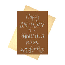 Load image into Gallery viewer, A dusky orange card with the words ‘Happy BIRTHDAY TO A FABULOUS person’ in an off white colour above some simple plant illustrations. Behind the card you can see a recycled brown paper envelope in front of a white background.
