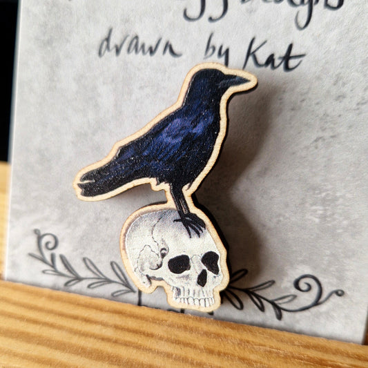 Bird-shaped brooch on a card with 'Duck Egg Designs drawn by Kat' text