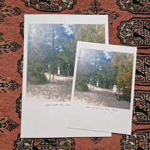 Load image into Gallery viewer, Two prints, one half the size of the other; both featuring two ghost at a sunny beach wood in dappled shade. Under the image is the words ‘Wells-next-the-Sea Beach Norfolk. Behind the prints is a red textured patterned background. 
