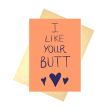 Load image into Gallery viewer, Bright orange card with the words &#39; I LIKE YOUR BUTT&#39; in dark purple handwriting across the middle. Under the writing are three dark blue hearts in a row, the middle one twice the size of the others. Behind the card is a recycled brown envelope, behind which is a white background.

