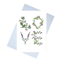 Load image into Gallery viewer, A white card with the word LOVE written on it in large. The letters are made up of flowers that begin with the same letter. L - lady&#39;s smock. O - ox-eye daisy, V - vervain and E - enchanters nightshade. Behind the card is a lilac envelope, behind which is a white background.

