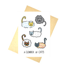 Load image into Gallery viewer, White card with cats that are part cloud with regular heads and tails with a cloud body. The cats are a variety of different colours inspired by the weather and the sky. At the bottom of the card are the words &#39;A CLOWDER OF CATS&#39; in black handwriting. Behind the card is a brown envelope at an angle, behind which is a white background.
