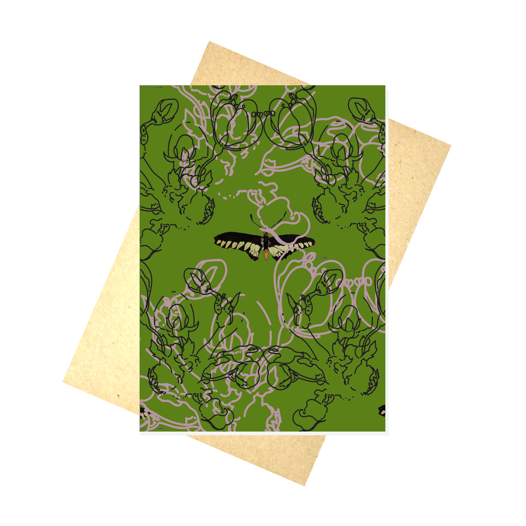 A mossy green card featuring a moth in the middle, with line drawings of blossom overlaying it in light pink and black. Behind the card is a brown envelope, behind which is a white background.