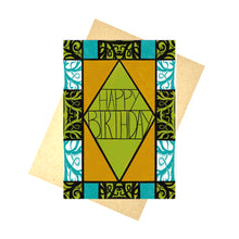 Load image into Gallery viewer, A colourful card sits in front of a brown envelope on a white background. The card featured the words &#39;HAPPY BIRTHDAY&#39; in the middle in black writing in front of a green background in a black outlines diamond. Around the green filled diamond is a vertical rectangle filled with a warm orange. Around the border of the card is different sections of patterned and unpatterned boxes in green, black, blue and white.
